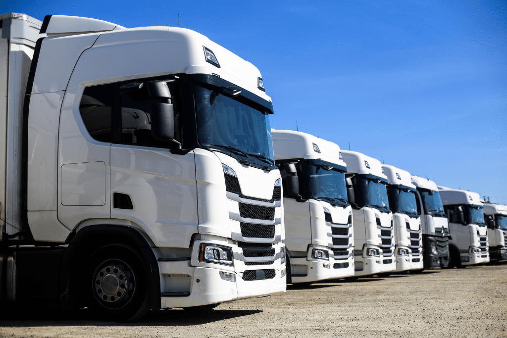 a row of lorries or trucks on a yard
