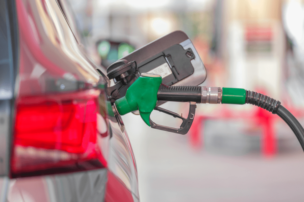 petrol pump filling up a car at a petrol station